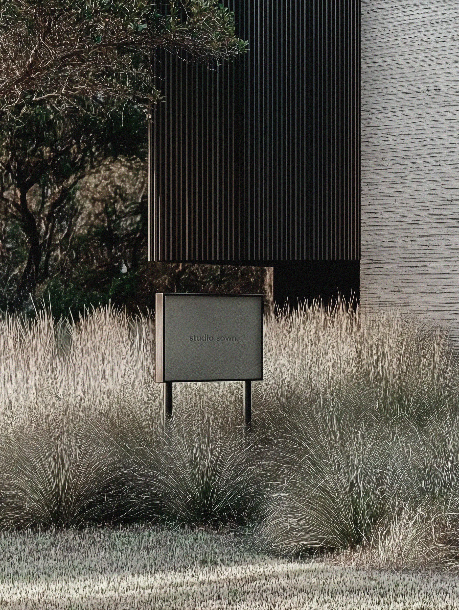 Studio Sown practice exterior with dark cladding, native grasses, and studio signage